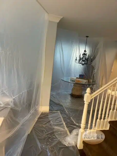 Hallway covered with plastic sheets, prepared for renovation work